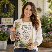 Load image into Gallery viewer, Woman holding Every Flower Must Grow Through Dirt metal sign in colorful flower garden setting
