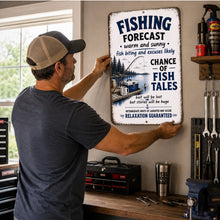 Load image into Gallery viewer, Man hanging Fishing Forecast metal sign in rustic garage workshop with fishing decor, tools, and lake-inspired man cave setting.
