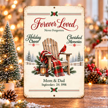 Load image into Gallery viewer, Personalized Christmas remembrance sign displayed beside holiday greenery and glowing lights, with a red cardinal, rocking chair, and family tribute.
