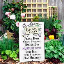 Load image into Gallery viewer, Inspirational Garden Rules sign displayed among flowers and greenery in a colorful outdoor garden setting.
