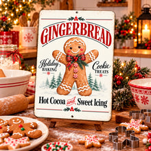 Load image into Gallery viewer, Festive gingerbread cookie sign displayed in a cozy Christmas kitchen surrounded by holiday decorations, baked treats, and warm seasonal accents.
