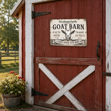 Load image into Gallery viewer, Funny personalized goat barn metal sign displayed on red barn door in rustic farm setting

