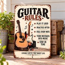 Load image into Gallery viewer, Guitar Rules sign featuring acoustic and electric guitar illustrations, resting against weathered wooden crates beside a potted plant and rustic lantern.
