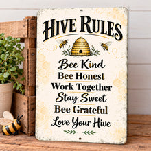 Load image into Gallery viewer, Vintage honey bee rules metal sign sitting on a wooden surface beside a rustic crate and potted greenery in warm farmhouse decor
