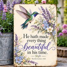 Load image into Gallery viewer, Inspirational Christian garden sign with blue-green hummingbird artwork and lavender blossoms displayed in a cozy porch setting.
