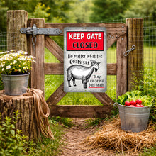 Load image into Gallery viewer, Wooden gate with a humorous goat sign about keeping the gate closed, surrounded by plants and vegetables.
