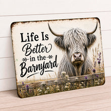 Load image into Gallery viewer, Highland cow barnyard metal sign displayed on rustic wall in farmhouse setting
