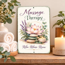 Load image into Gallery viewer, Massage Therapy metal sign displayed on a wooden spa shelf with rolled white towels, eucalyptus greenery, and a glowing candle in a peaceful wellness setting.
