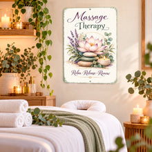 Load image into Gallery viewer, Massage Therapy wall sign hanging above a massage table in an elegant treatment room decorated with white towels, greenery, candles, and warm lighting.
