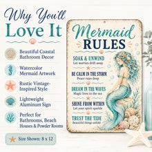 Load image into Gallery viewer, Mermaid-themed bathroom sign with a distressed vintage design, featuring a teal mermaid illustration and the text 'Mermaid RULES.' The left side includes marketing text and icons describing coastal decor appeal, and the sign is shown on a light neutral background with decorative seashell and starfish props.
