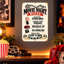 Load image into Gallery viewer, Vintage movie night metal sign displayed in a home cinema setting with a dark interior, warm lighting, and film-themed accessories.
