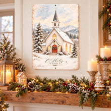 Load image into Gallery viewer, Snowy country church wall sign displayed in a cozy farmhouse interior with Christmas garland, warm window light, and rustic seasonal accents.
