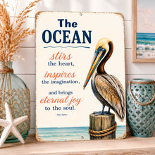 Load image into Gallery viewer, Inspirational pelican sign displayed in coastal beach house decor setting with ocean-themed artwork and seaside accents
