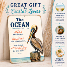 Load image into Gallery viewer, Pelican coastal wall decor sign featuring The Ocean Stirs the Heart quote, meaningful gift for beach lovers and coastal homeowners
