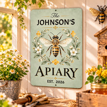 Load image into Gallery viewer, Personalized beekeeper metal wall art displayed in a sheltered porch setting with flowering plants and rustic country decorations.

