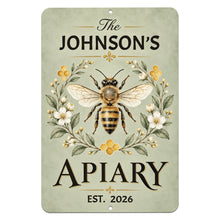 Load image into Gallery viewer, Personalized apiary metal sign featuring The Johnson's Apiary, Est. 2026, with a detailed honeybee illustration, botanical flowers, and sage-green background.
