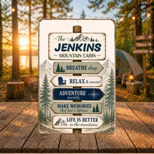 Load image into Gallery viewer, Personalized mountain cabin sign displayed outdoors at a rustic campsite surrounded by pine trees and mountain-inspired décor

