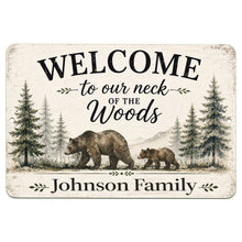 Load image into Gallery viewer, A rectangular personalized wooden-style sign with rounded corners, featuring a rustic off-white background, black text reading “WELCOME to our neck of the Woods” and “Johnson Family,” and an illustration of an adult bear, a cub, pine trees, and mountains.
