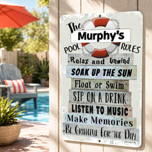 Load image into Gallery viewer, A personalized rectangular metal sign with a weathered white background and rustic wood-style text panels. The sign reads 'The Murphy's Pool Rules' with a red-and-white life preserver graphic at the top.
