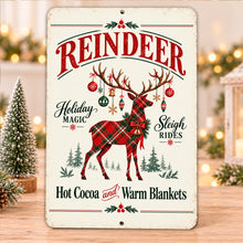 Load image into Gallery viewer, Traditional plaid reindeer sign displayed against a softly lit Christmas background with seasonal greenery and warm festive details.
