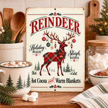 Load image into Gallery viewer, Festive reindeer aluminum sign displayed on a wooden surface with cozy holiday decorations and traditional Christmas accents.
