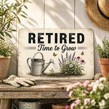 Load image into Gallery viewer, Retired Time to Grow aluminum garden sign with watering can and flowers displayed on rustic potting bench patio decor scene
