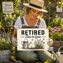 Load image into Gallery viewer, Woman holding Retired Time to Grow aluminum garden sign in flower garden retirement gift decor scene
