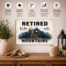Load image into Gallery viewer, Decorative sign with mountain and cabin design on a wall above a wooden table.

