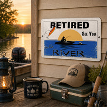 Load image into Gallery viewer, Retired river sign mounted on cabin wall with screws overlooking lake at sunset
