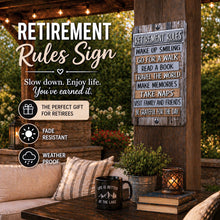 Load image into Gallery viewer, Retirement rules sign mounted on outdoor pergola with patio seating and warm lighting

