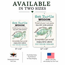 Load image into Gallery viewer, Two decorative metal signs with sea turtle artwork and the phrase 'Sea Turtle WISDOM' shown on a white background with text reading 'AVAILABLE IN TWO SIZES' and size labels 8" x 12" and 12" x 18". Additional product info includes pre-drilled holes, top and bottom hanging, and made in the USA.
