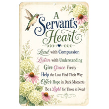 Load image into Gallery viewer, A rectangular decorative sign with rounded corners featuring the phrase “A Servant’s Heart” in stylized script and serif text, surrounded by floral illustrations and a hummingbird. The sign has a cream background with navy, green, pink, and peach text and border details.
