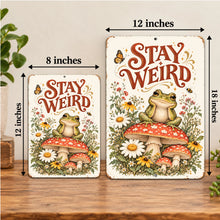 Load image into Gallery viewer, Stay Weird Frog Metal Sign shown in 8x12 and 12x18 inch sizes, featuring a cute green frog, red mushrooms, wildflowers, and vintage botanical artwork.
