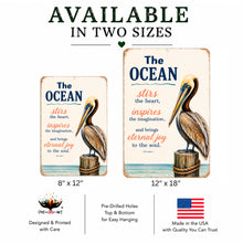 Load image into Gallery viewer, The Ocean Stirs the Heart pelican metal sign available in 8x12 and 12x18 sizes, coastal wall decor made in USA
