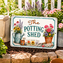 Load image into Gallery viewer, The Potting Shed sign displayed among flowers in a backyard garden
