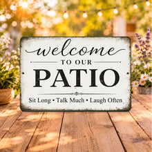 Load image into Gallery viewer, Rustic farmhouse patio welcome sign displayed on a wooden backyard table with outdoor string lights and flowers in a cozy backyard setting.
