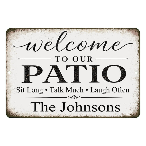 Decorative metal sign with 'Welcome to our Patio' text and personalized name on a white background