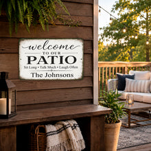 Load image into Gallery viewer, Custom family name patio sign displayed in outdoor living space with seating area
