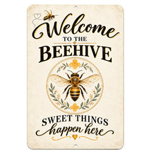 Load image into Gallery viewer, Welcome to the Beehive aluminum sign featuring a detailed honeybee, botanical wreath, golden flowers, and Sweet Things Happen Here lettering on a cream background.
