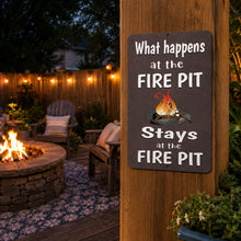 Load image into Gallery viewer, Fire pit metal sign displayed beside a cozy backyard fire pit with outdoor seating and string lights
