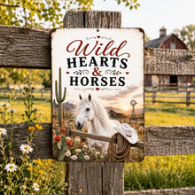 Load image into Gallery viewer, Wild Hearts &amp; Horses metal sign displayed outdoors on rustic fence at a country horse farm
