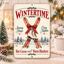 Load image into Gallery viewer, Vintage ice skates metal sign featuring red plaid bows and cozy winter sayings, displayed with Christmas greenery, warm lights, and a mug of hot cocoa.
